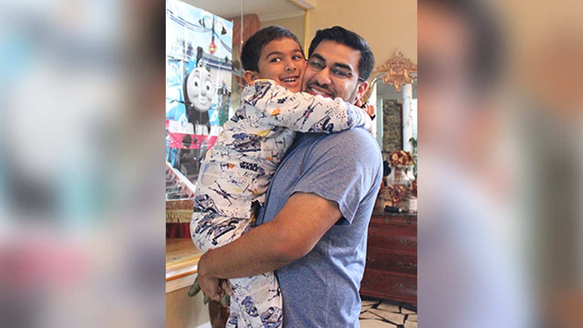 Five-year-old Aziz Khan with his father, Abdul Khan