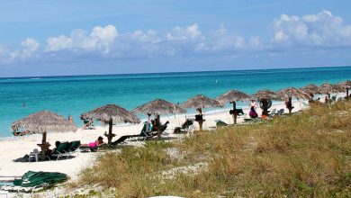 Caribbean police work to ID body found during search for missing American as nearby security guard was killed