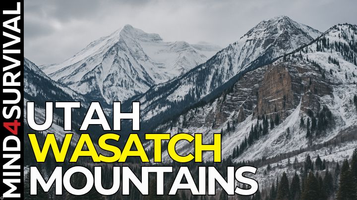 Snow-covered Wasatch Mountains in Utah, with rugged cliffs and pine forests