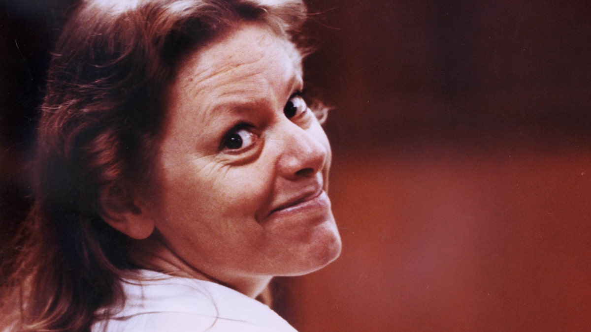 Aileen Wuornos with her face turned smiling.