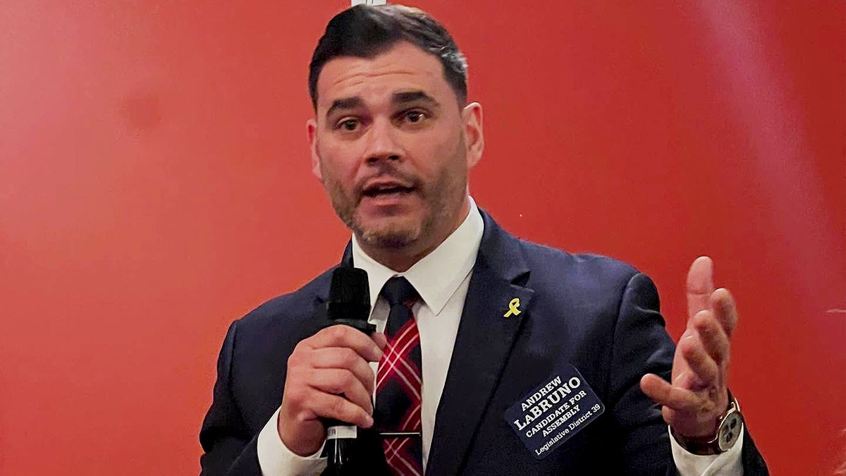 Andrew LaBruno speaking into mic