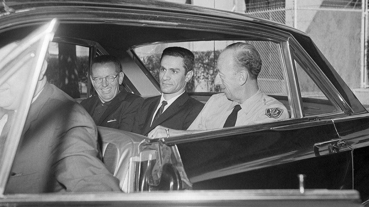 George Nassar inside a police car.