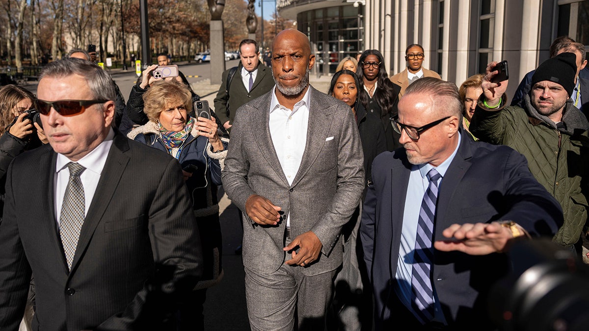 Chauncey Billups walks with his family and legal team