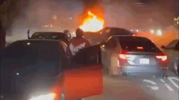 Video shows wild neighborhood street takeover as violent mob pummels couple, burns truck Video shows wild neighborhood street takeover as violent mob pummels couple, burns truck