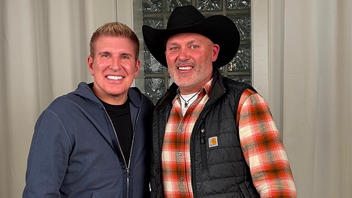 Steve McBee Sr. and Todd Chrisley smiling at the camera.