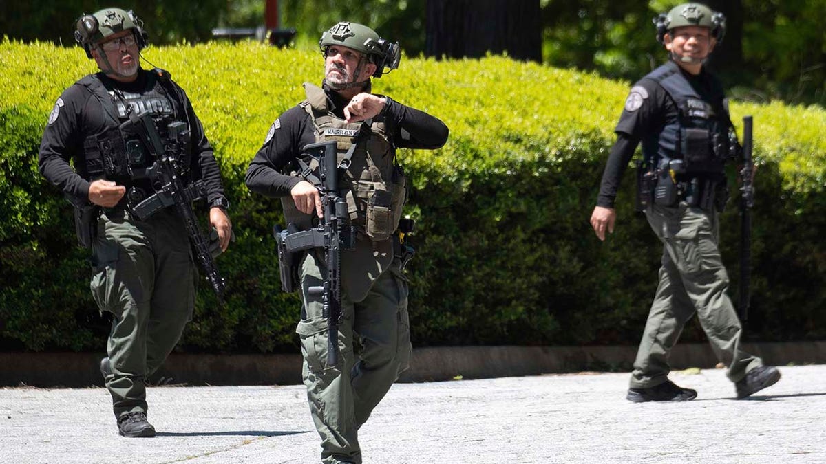 Police and emergency workers gather in Atlanta