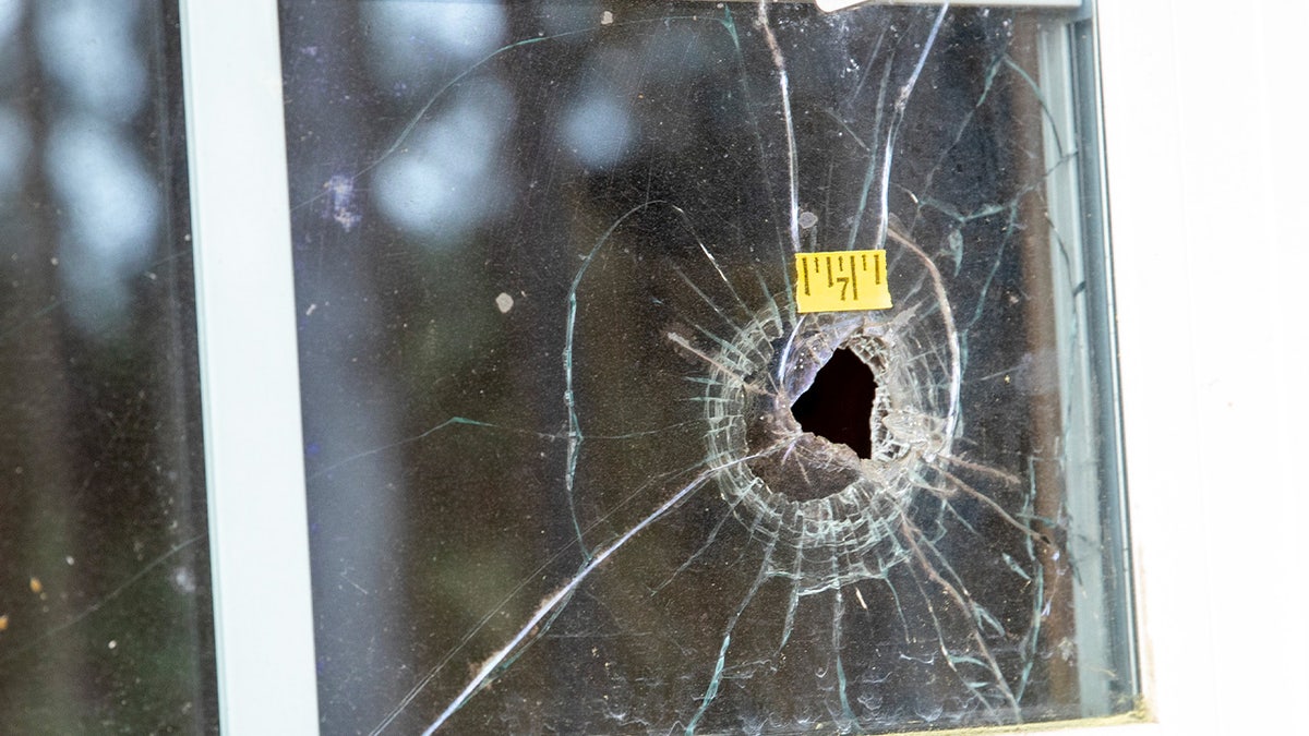 Bullet holes are seen in the glass at the Murdaugh Moselle property