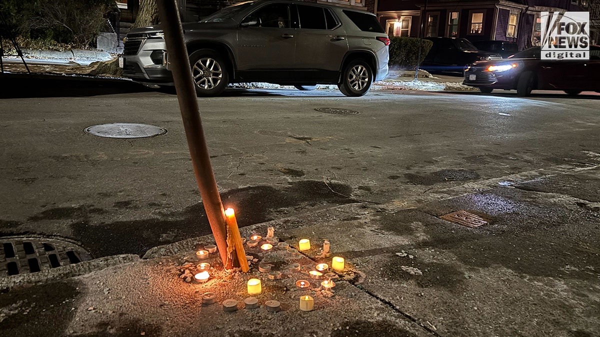 Candles left in memory of MIT professor Numo Louriero