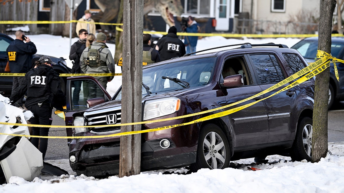 Law enforcement officers gather after a fatal incident.