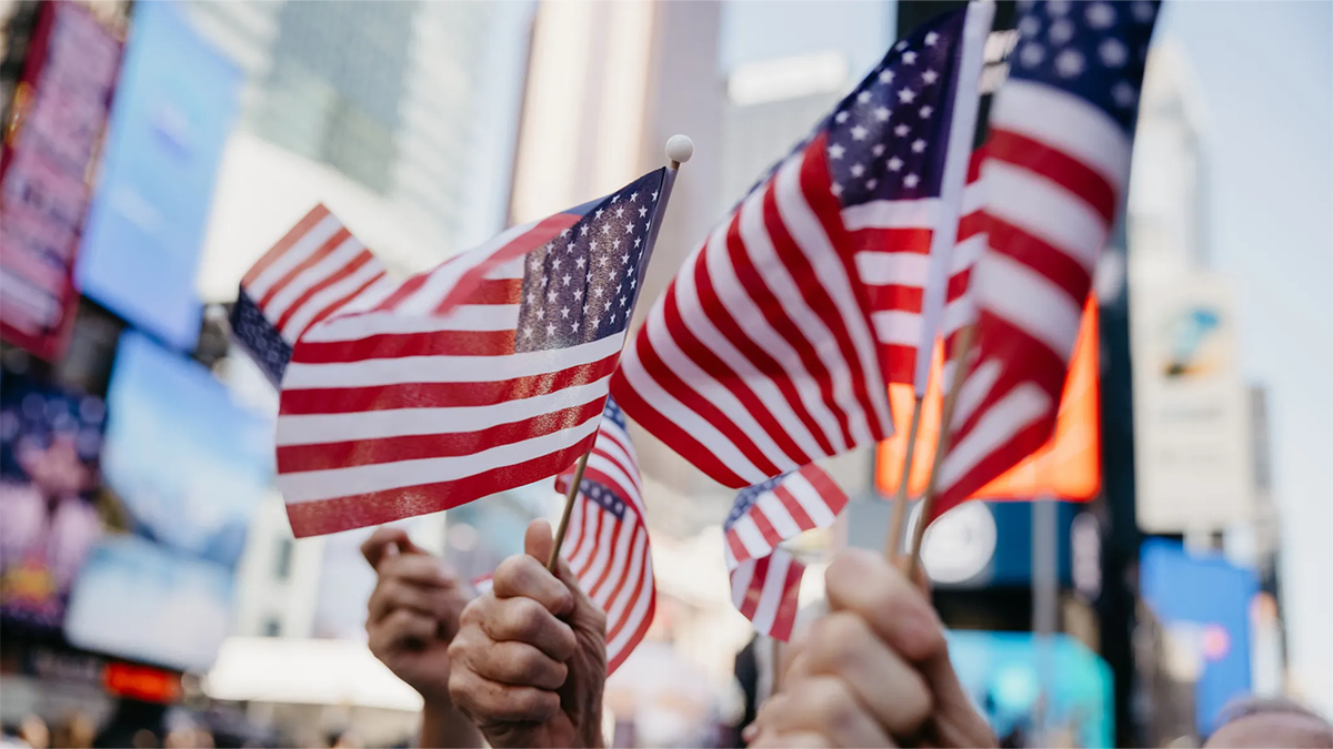American flags being waved in New York City