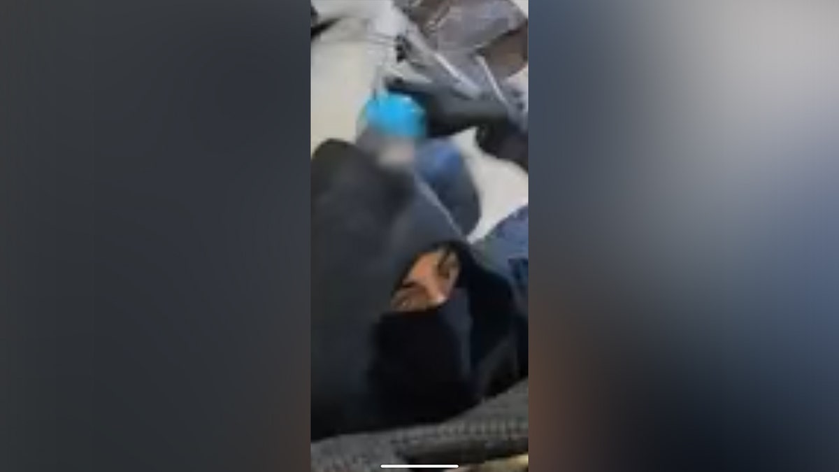 Masked suspects are seen on surveillance video in The Bella Abby and Ava Boutique