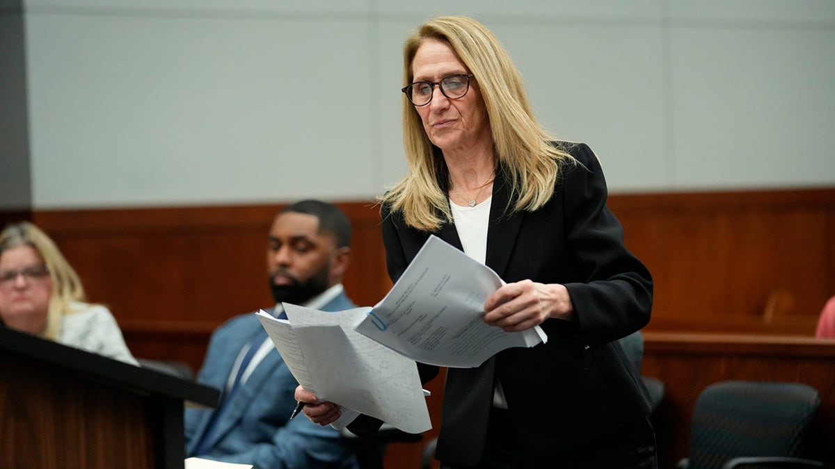 Ellen Michaels prepares to speak