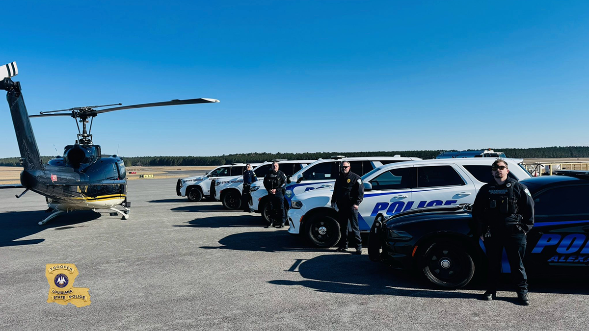 Law enforcement near police helicopter
