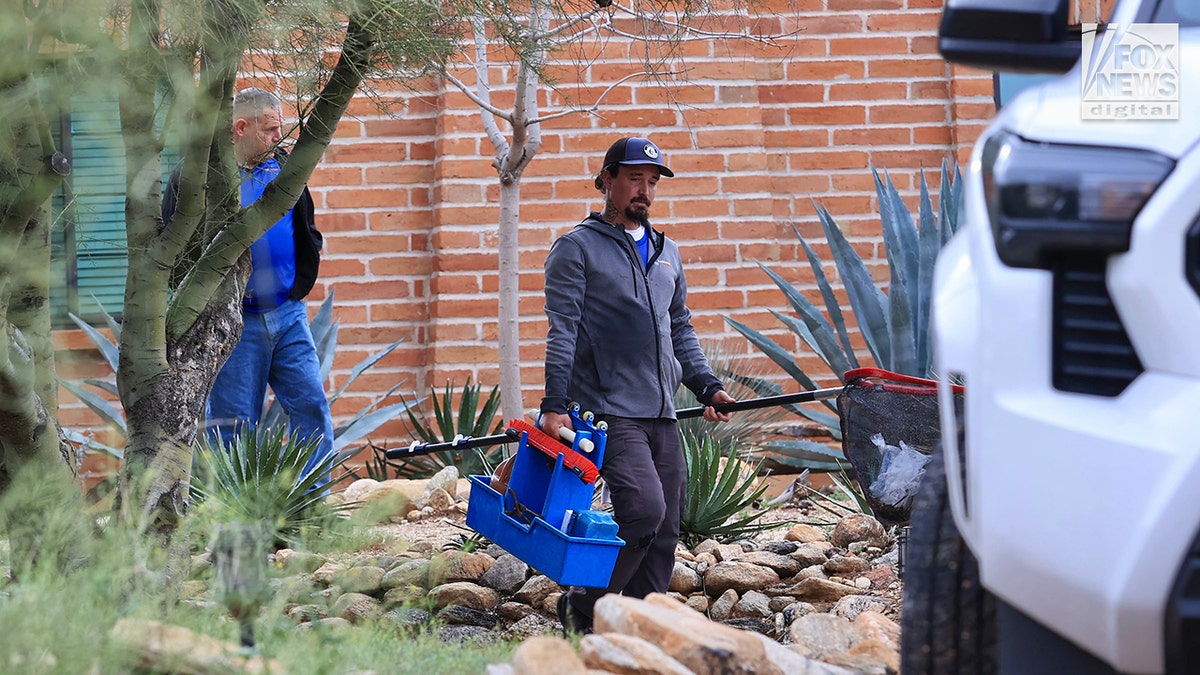 Pool cleaners leave the backyard of Nancy Guthrie's home