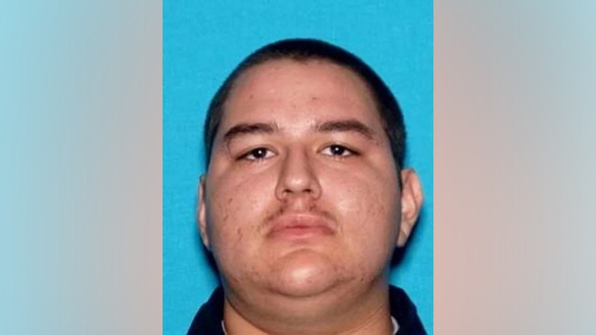 Omar Cardenas mugshot against a blue background