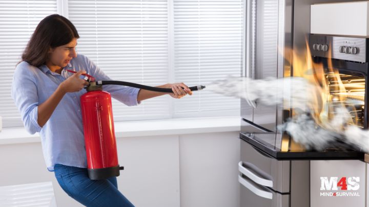 A woman using a fire extinguisher