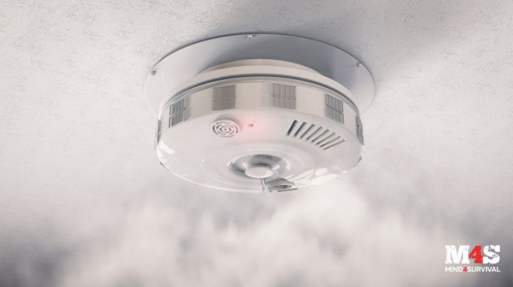 A smoke alarm in a room filled with smoke. 