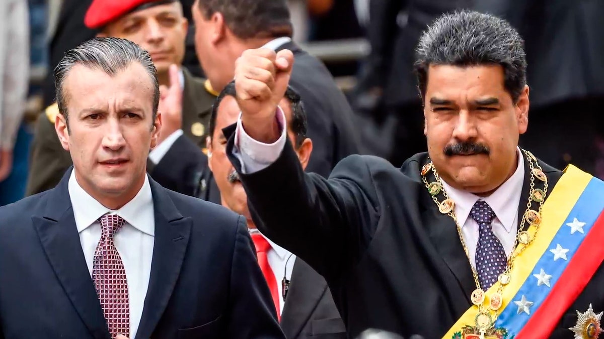 Maduro holds up his fist