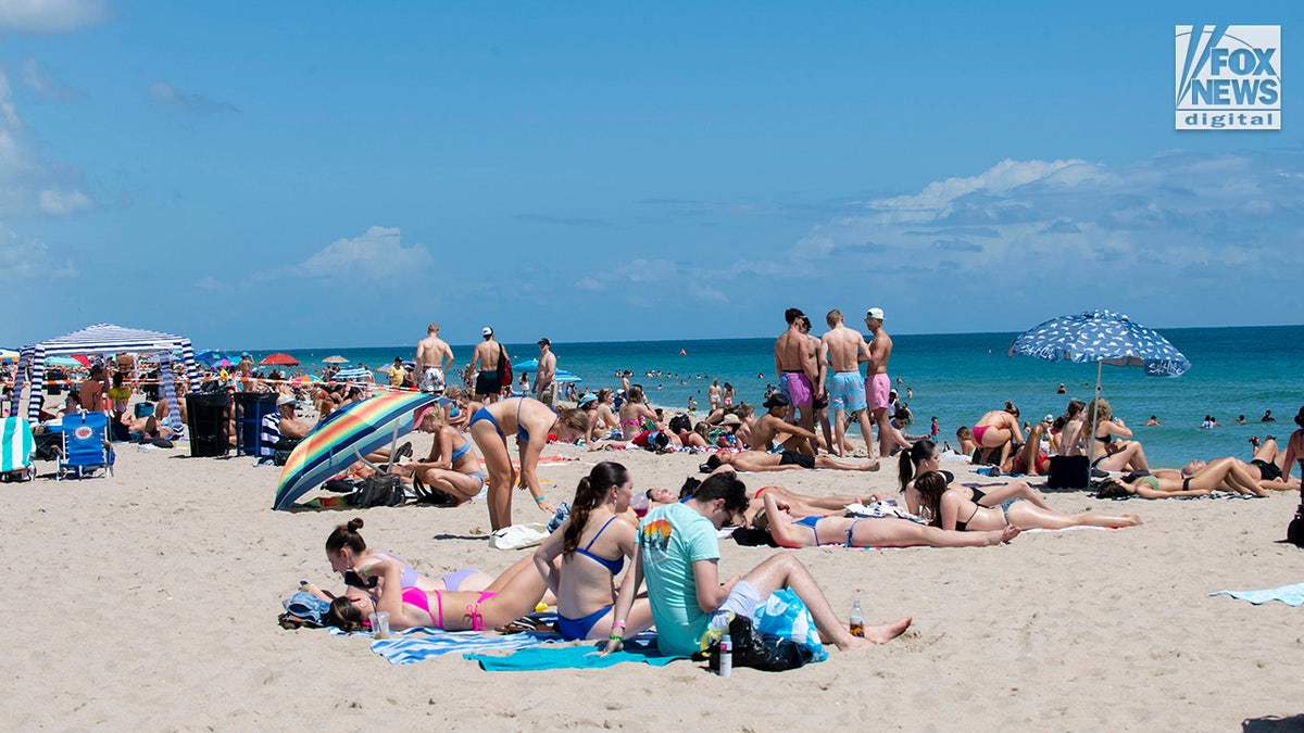 Spring breakers enjoy the sun and sand on Fort Lauderdale Beach