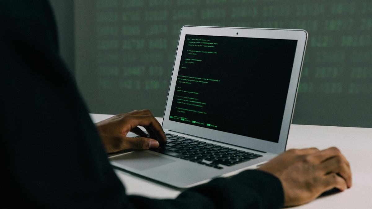 hacker on laptop
