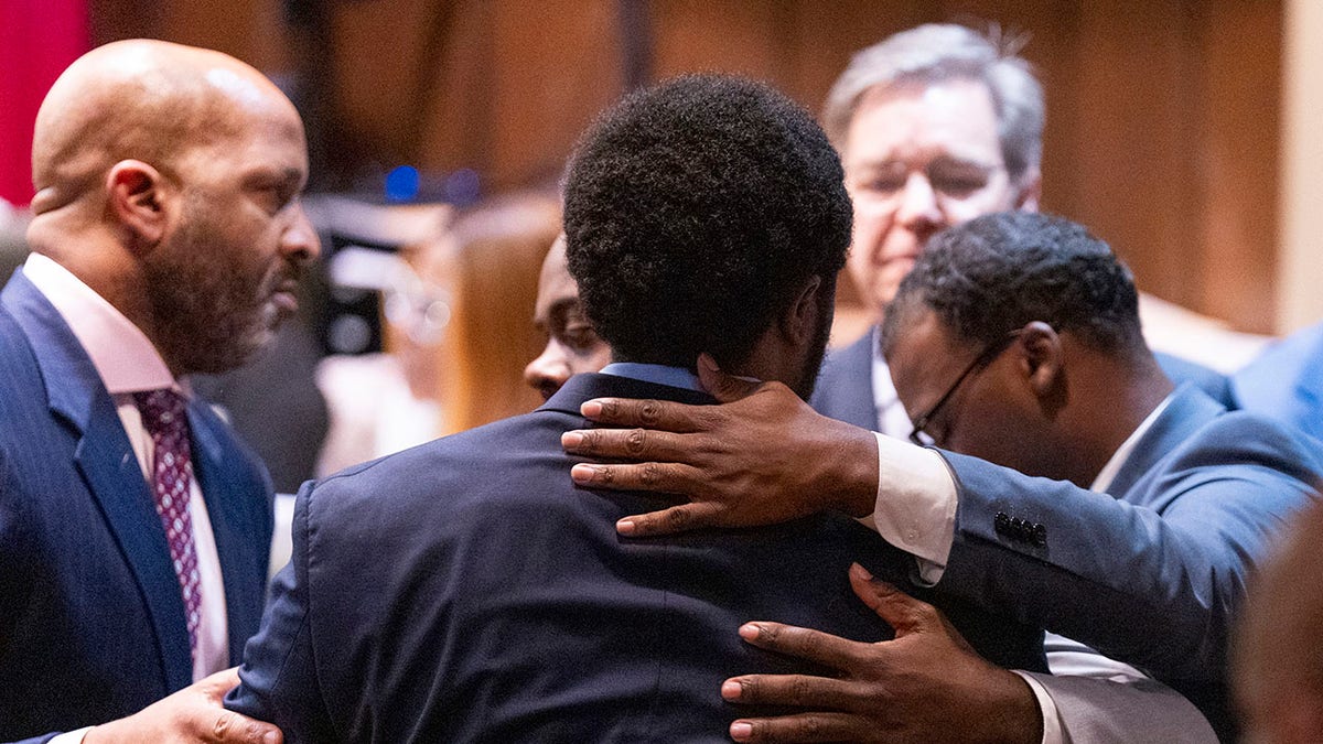 Memphis police officers embrace after not guilty verdicts