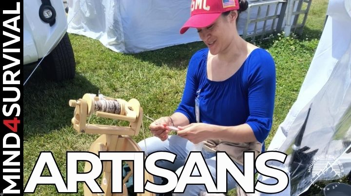 A woman in a USMC hat spinning wool by hand at Mountain Readiness Expo 2025