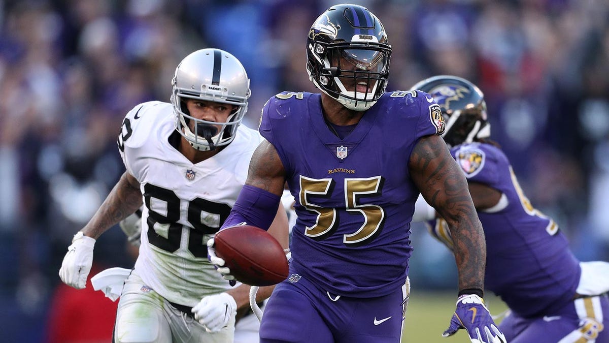 Terrell Suggs runs back a fumble