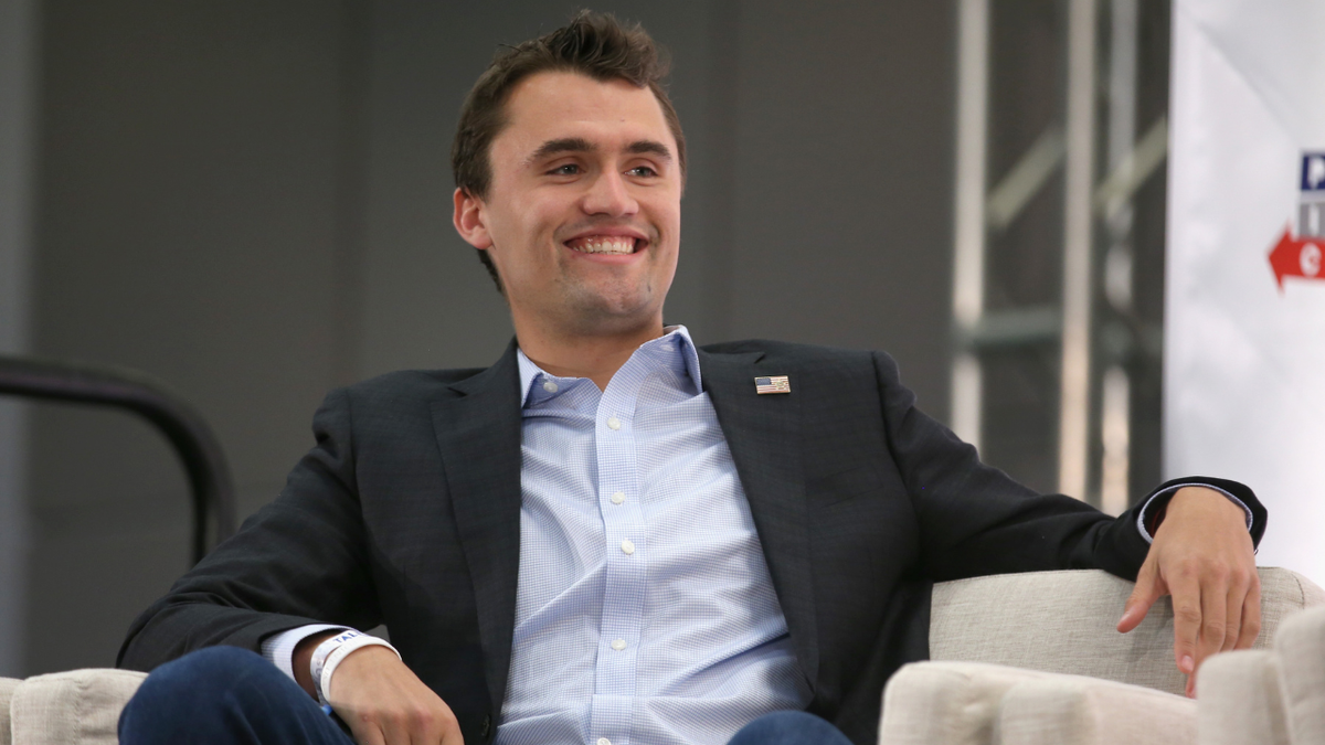 Charlie Kirk listens onstage during Politicon 2018 event