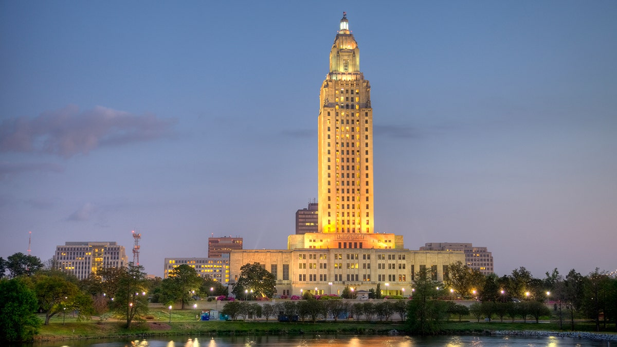 Louisiana State Capitol along the banks of a small pond. Louisiana State Capitol is located in downtown Baton Rouge. Baton Rouge is the second largest city in louisiana located on the banks of the Mississippi River.