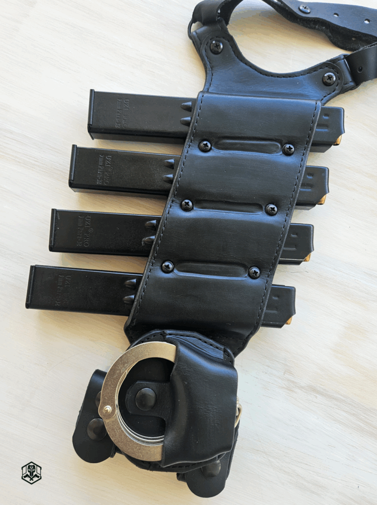 four loaded Uzi Pro magazines and a secured handcuff pouch