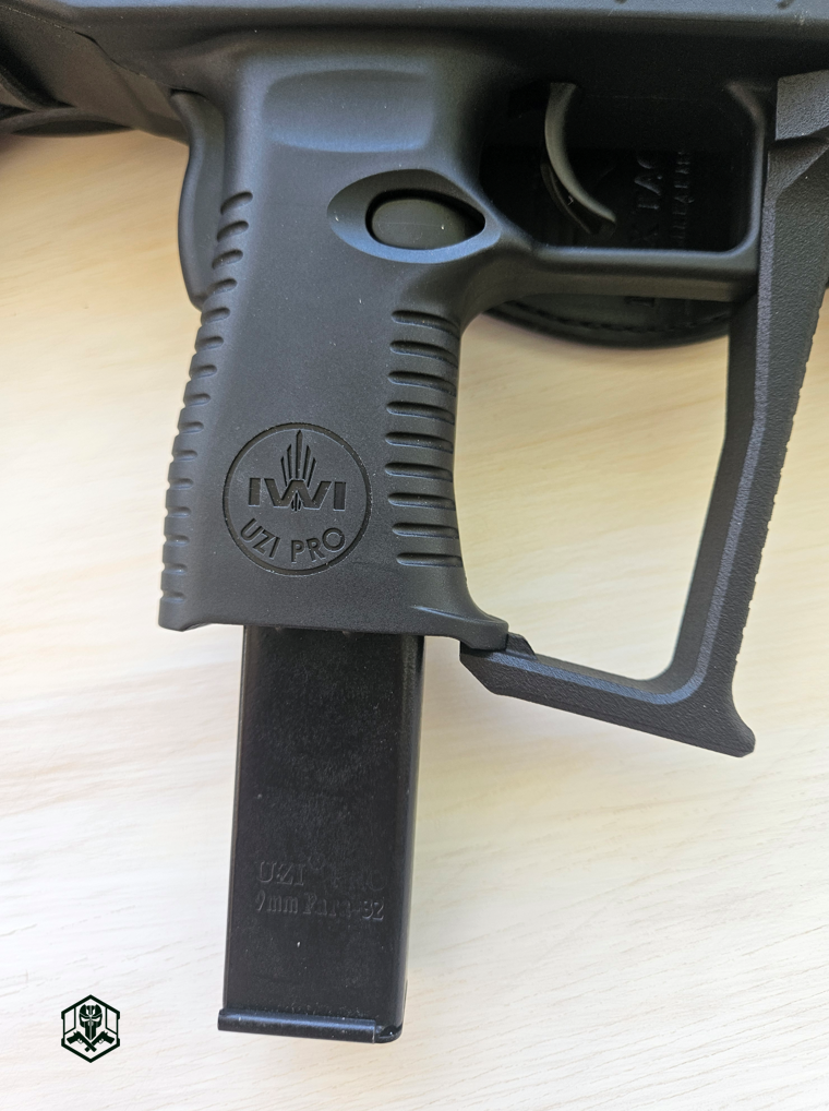 Uzi Pro’s polymer grip, A2 Tactical foregrip, and magazine well with IWI branding and 9mm magazine