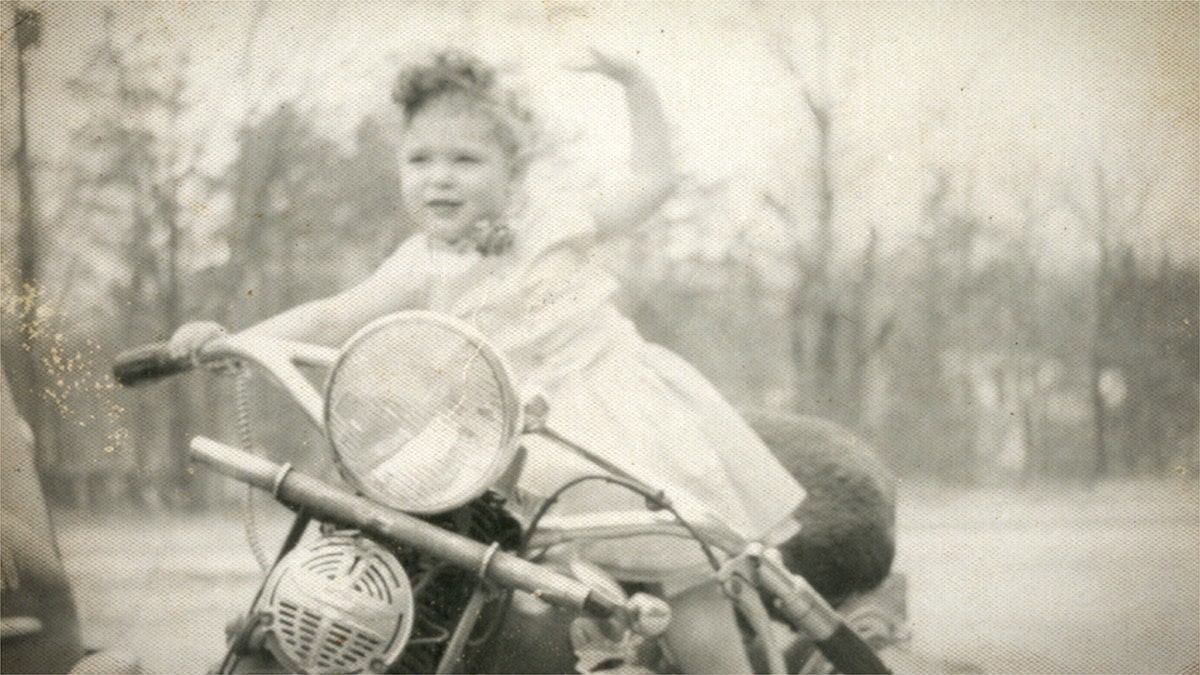 Jean Kennedy on her father's motorcycle.