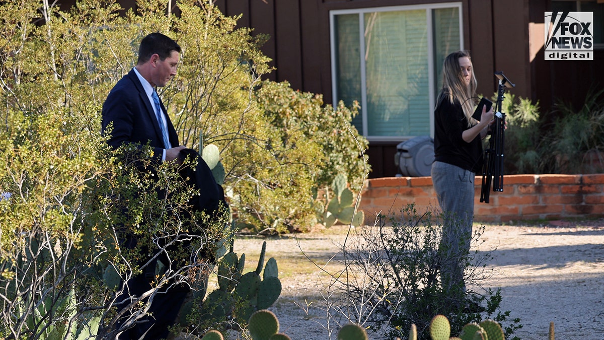 Investigators at Annie Guthrie's home.