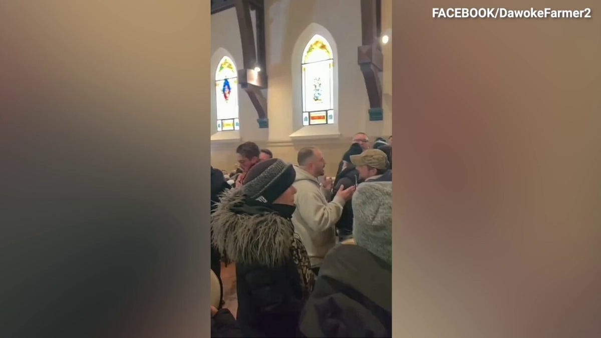 Anti-ICE protesters inside a church