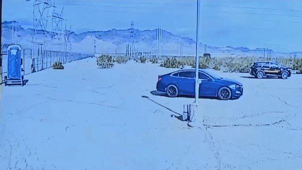 GIF image of a car crashing through a gate