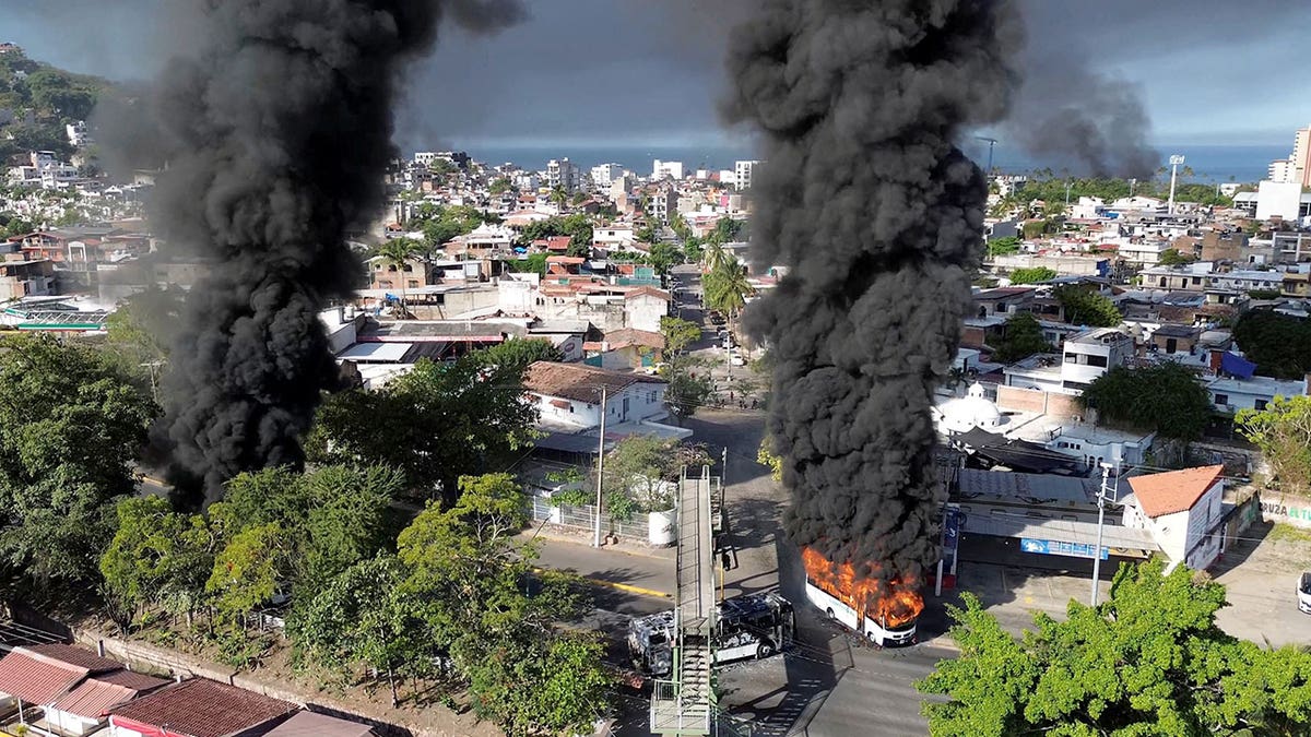 Smoke billows, following a military operation in which a government source said Mexican drug lord Nemesio Oseguera, known as "El Mencho," was killed, in Puerto Vallarta